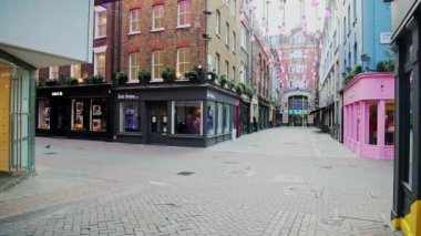 Empty London Roads during Coronavirus Lockdown at quiet, deserted Carnaby Street in Soho, a popular tourist area during the global pandemic Covid-19 shutdown in England, Europe