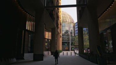 Quiet street in the business area of the City of London during Covid-19 lockdown at quiet, deserted Bloomberg Arcade in the global pandemic Coronavirus shutdown in England, Europe