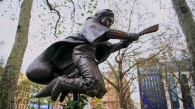 Harry Potter Statue at Leicester Square in London in a popular tourist attraction area in England, Europe