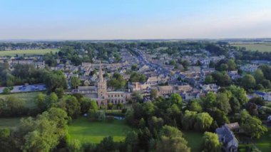 Aerial Drone View of Cotswolds Village and Burford Church in England, a Popular English Picturesque Tourist Destination in the Countryside of Gloucestershire