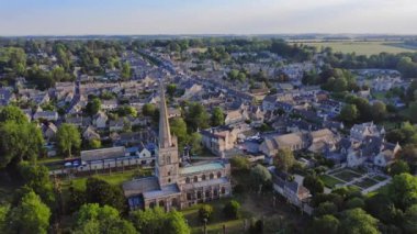 Aerial Drone View of Cotswolds Village and Burford Church in England, a Popular English Picturesque Tourist Destination in the Countryside of Gloucestershire