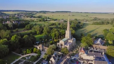 Aerial Drone View of Cotswolds Village and Burford Church in England, a Popular English Picturesque Tourist Destination in the Countryside of Gloucestershire