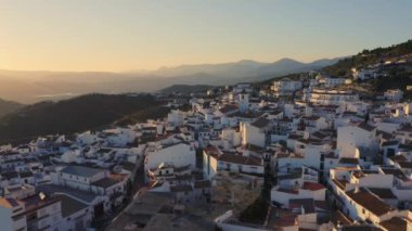 Aerial Drone View of Spain, Spanish Town in Mountains at Sunset, Costa Del Sol, Andalusia (Andalucia), Europe, Traditional White Houses and Homes Popular in Property Real Estate Housing Market, Europe