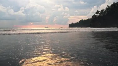 Costa Rica Beach Landscape at Sunset on Pacific Coast at Playa Ventanas by Ballena Marine National Park (Marino Ballena), Coastal Scenery with Dramatic Sunset Clouds and Waves, Central America