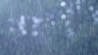 Rain Close Up, Raining in Rainy Season in a Tropical Rain Storm During Horrible Wet Bad Weather, Typical Climate in the Tropics in Costa Rica, Central America, with Blue Background
