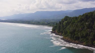 Aerial Drone View of Rainforest and Ocean on the Pacific Coast in Costa Rica, Tropical Jungle Coastal Landscape Scenery with the Sea and Coastline at Ballena Marine National Park