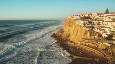 Aerial Drone View of Portugal Coastal Town with Houses in Housing Market in Sintra, Lisbon, Europe, Cliff Top Properties and Homes on Coast with Sea View at Praia Das Azenhas Beach