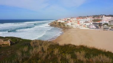 Aerial Drone View of Sandy Beach at Lisbon, Portugal at Praia das Macas, a Beautiful Coastal Town on the Atlantic Coast on Top of a Cliff, a Popular Tourist Destination in Europe