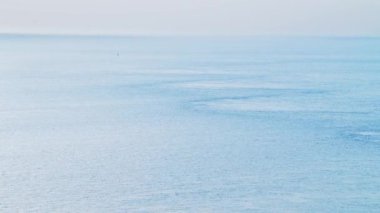 Aerial Drone View of Calming Peaceful Blue Ocean Seascape Background of Vast Sea with Copy Space, Calm Still Water on the Coast