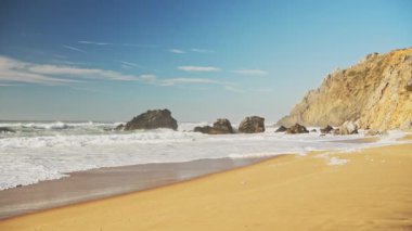 Praia Da Adraga Beach in Portugal, Lisbon (Lisboa), a Beautiful Sandy Popular Place on the Portugese Coast, Seascape on Sunny Day With Blue Sky at Sintra, Europe