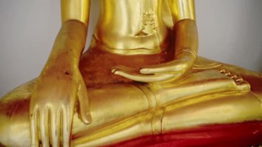 Thailand Gold Buddha Buddhist Statue at Beautiful Bangkok Famous Temple at Wat Pho (Temple of the Reclining Buddha), Close Up of Hand of Gold Leaf Buddha in Lotus Position