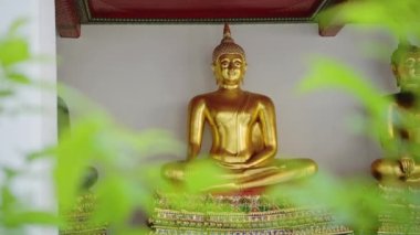 Thailand Gold Buddha Buddhist Statue at Beautiful Bangkok Temple at Wat Pho (Temple of the Reclining Buddha), Gold Leaf Buddha in Lotus Position, Iconic Buddhism Symbol in Southeast Asia