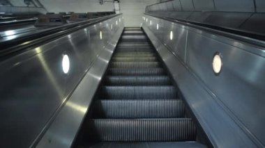 Quiet escalator in London Underground tube train station in Covid-19 Coronavirus pandemic lockdown in England, UK deserted with no people at rush hour