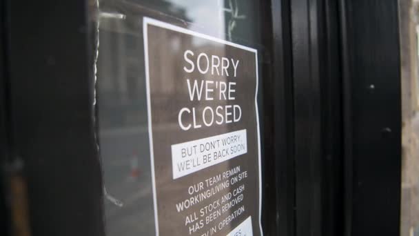 Coronavirus Covid Information Sign Shut Shop Window Saying Sorry Closed — Stock video