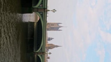 Vertical video of River Thames and Westminster Bridge in London in Coronavirus Covid-19 lockdown, showing quiet, empty iconic famous building and tourist attraction in England, UK