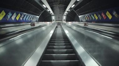 Quiet escalator in London Underground tube train station in Covid-19 Coronavirus pandemic lockdown in England, UK deserted with no people at rush hour