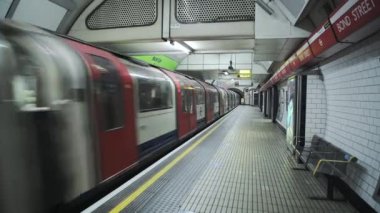 London Underground tube train in Covid-19 Coronavirus lockdown pandemic in England, UK showing Bond Street Station empty, quiet and deserted with no people on the platform