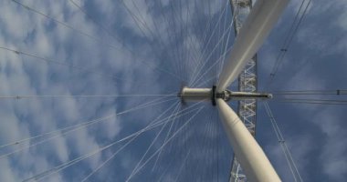 Vertical London timelapse of The London Eye, a time lapse of clouds moving and blue sky at the famous tourist attraction, stationary due to Covid-19 Coronavirus pandemic lockdown, England, Europe