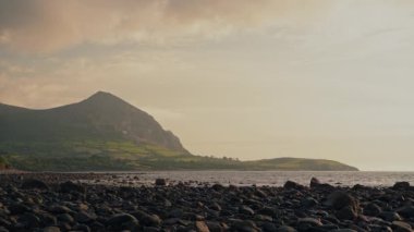 Breathtaking coastal scenery of Llyn Peninsula with golden hour sunlight, static