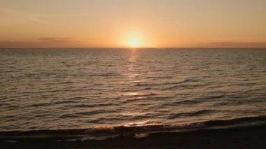 Sunset on Horizon of Ocean Beach Coast in Wales - Static Tripod View