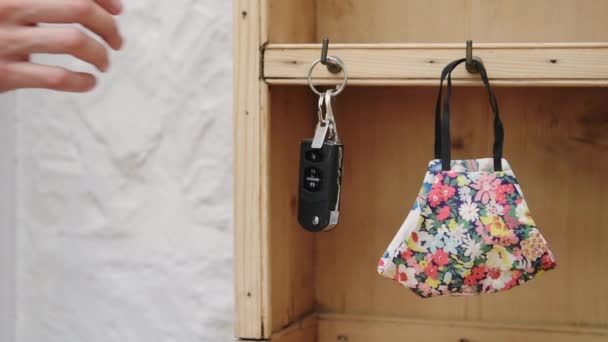 Female Hand Picking Floral Face Mask Car Keys Going Out — Stok video