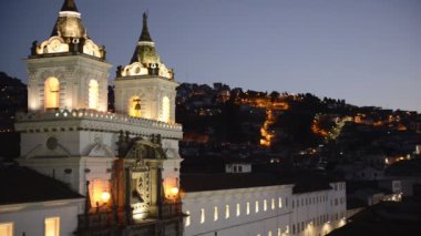 Cityscape mountain view over San Francisco church, Quito, Ecuador, at dusk