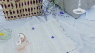 Champagne And Tiny Purple Lavender Flowers On The Flat Lay Luxury Summer Picnic Set Up - close up