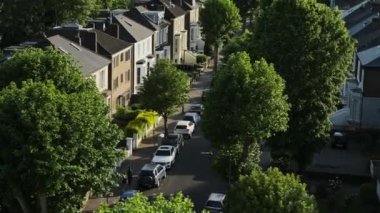 Scenic View Of Houses And Green Trees At The Residential Terraced Housing In Central North London, United Kingdom - aerial drone shot