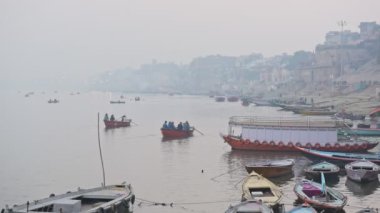 Groups Of People Sailing On Boats On The River Ganges In Varanasi, Uttar Pradesh, India On A Foggy Day - Wide Shot
