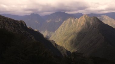 Peruvian mountains landscape view from the Sun Gate, on a cloudy evening