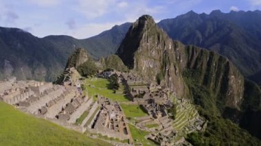 Machu Picchu ruins and terraces view from above, on a sunny day, Peru