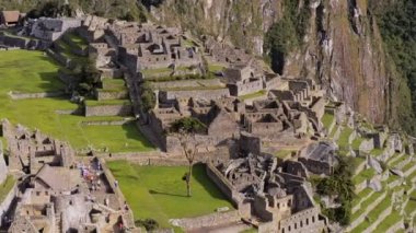 Machu Picchu ruins and terraces view from above, on a sunny day, Peru