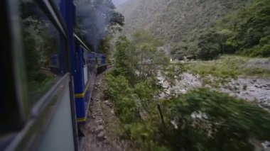 Mountain forest view from a train window, from Cusco to Machu Picchu, Peru