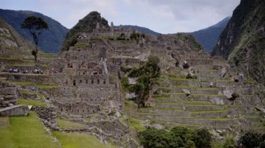 Machu Picchu ruins and terraces landscape view, with mountains in the background, Peru