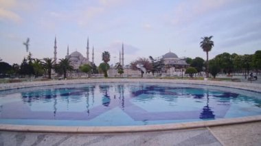 Landscape view of the Blue Mosque, with birds flying, Istanbul, Turkey, at dusk