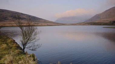 Windy evening view of a lake in Snowdonia national park, Wales