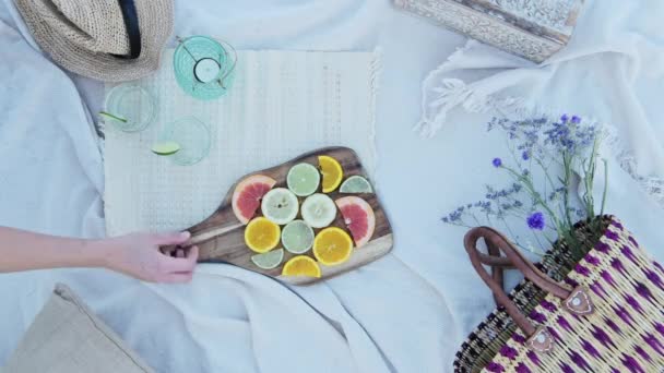 Hand Taking Wooden Picnic Board Picnic Rug Beautiful Citrus Fruit — Vídeo de stock