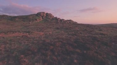Dartmoor National Park scenery at sunset, Devon, England, UK. Aerial drone view