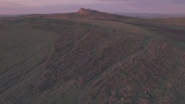Dartmoor National Park landscape at sunset, Devon, England, UK. Aerial drone view
