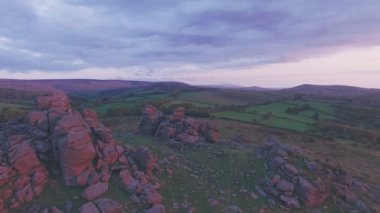 British countryside landscape in Dartmoor National Park at sunrise, Devon, England, UK. Aerial drone view