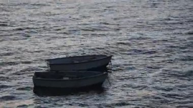 Small empty boats anchored by the shore of Guernsey - close up
