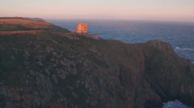 German observation tower from World War Two at sunset, Guernsey, Channel Islands, UK. Aerial drone view