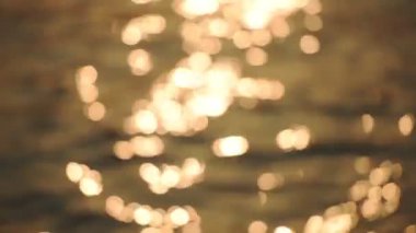 Beautiful Bokeh Of Sun Reflection On The Water Surface During Sunset Time In Hong Kong.- close up shot