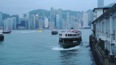 Star Ferry Boats Arriving At The Port In Victoria Harbour, Hong Kong - Medium Shot