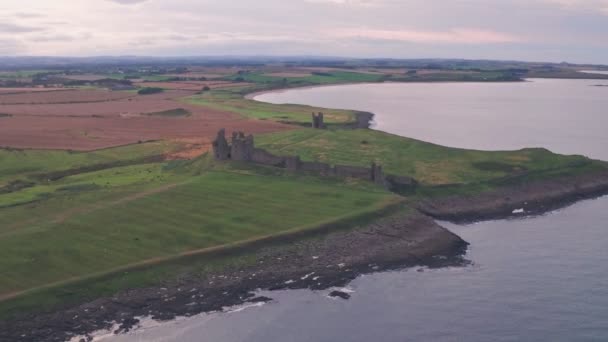 Ruins Dunstanburgh Castle Sunset Northumberland England Aerial Drone View — стоковое видео