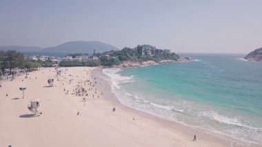 Tropical, beautiful Shek O Beach, a white sandy stretch of sand in Hong Kong Island. Aerial drone view