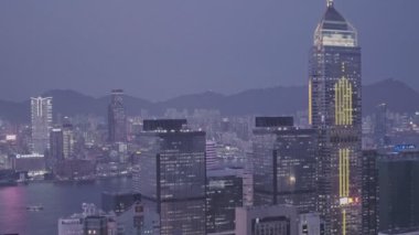 Central Plaza skyscraper in the Hong Kong city skyline at night. Aerial drone view