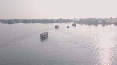 Houseboat trip in Kerala backwaters at Alleppey, India. Aerial drone view