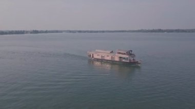 Houseboat trip in lake of Kerala backwaters at Alleppey, India. Aerial drone view