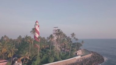 Thangassery Lighthouse at sunset in Kerala, India. Aerial drone view